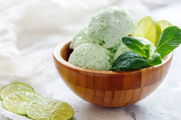 Homemade lime and mint ice cream in a wooden bowl.