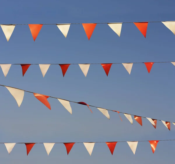 String of christmas flags or garland isolated on sky photo — Stock Photo, Image