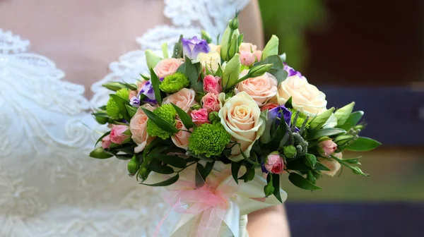 Elegance bouquet in the hands — Stock Photo, Image