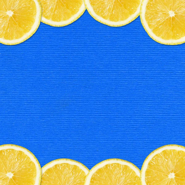 Lemon slices on blue — Stock Photo, Image