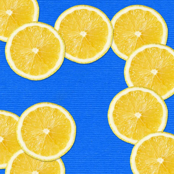 Yellow slices on blue — Stock Photo, Image