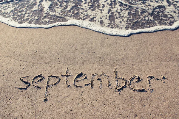 September på stranden sand — Stockfoto