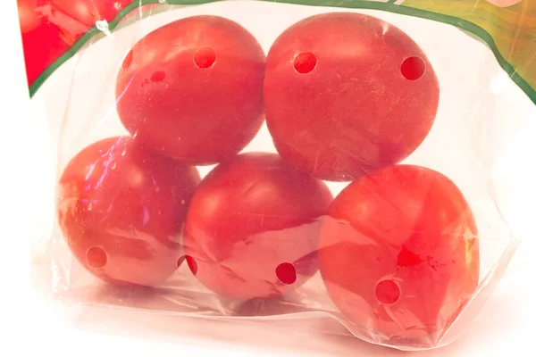 Tomatoes in a plastic bag package — Stock Photo, Image