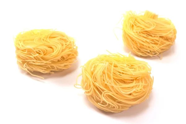 Vermicelli pasta nests isolated on white — Stock Photo, Image