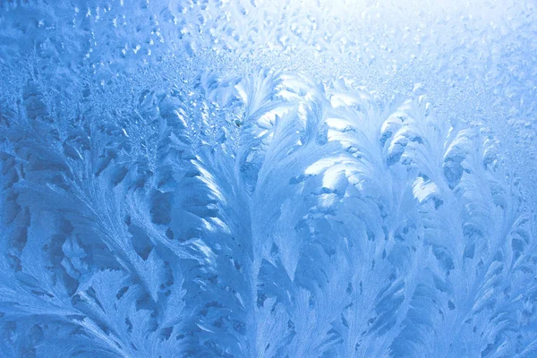 Ice pattern on window in winter as background — Stock Photo, Image