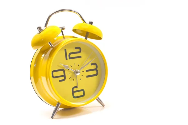 Relógio de alarme amarelo isolado no branco — Fotografia de Stock