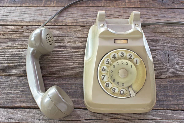 Old telephone on wooden background — Stock Photo, Image