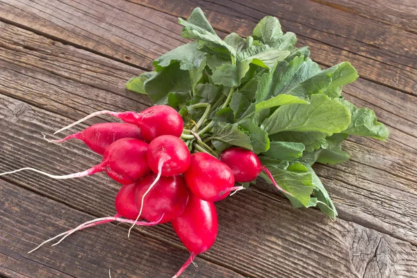 Fresh radish on old wooden table — Stock Photo, Image