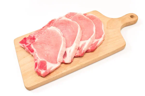 Raw pork chop meat on cutting board isolated on white — Stock Photo, Image