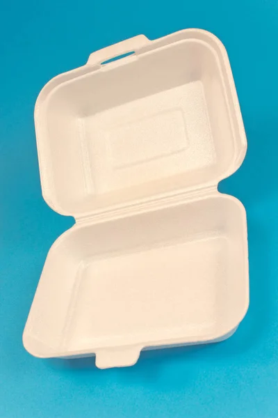 Styrofoam box for food isolated on blue background — Stock Photo, Image