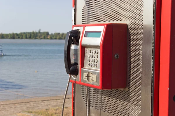 Public telephone - outdoors by the river — Stock Photo, Image