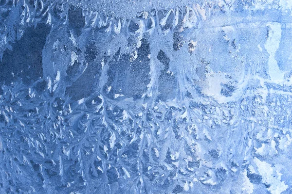 Ice pattern on window glass in winter time — Stock Photo, Image