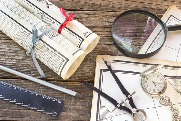 Old Maps with tools on wooden background — Stock Photo, Image