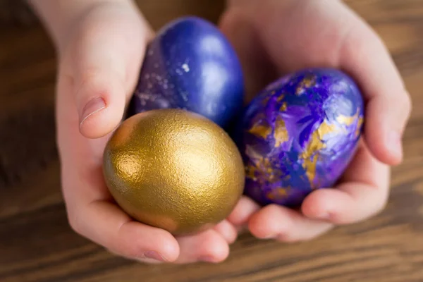 Easter eggs in the hands of a child