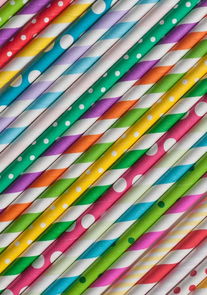 Stack of plastic colored drinking straws.