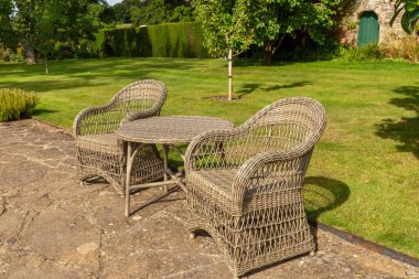 Two chairs in the park during sunny day.