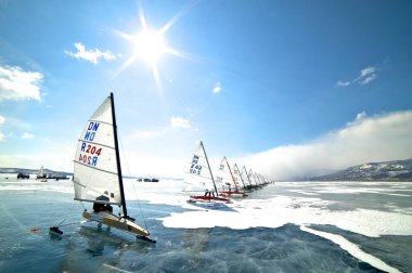 NOVOSIBIRSK,RUSSIA-DECEMBER21:Ice sailing on the frozen lake competition clipart