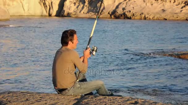 Fisherman and sunset light — Stock Video