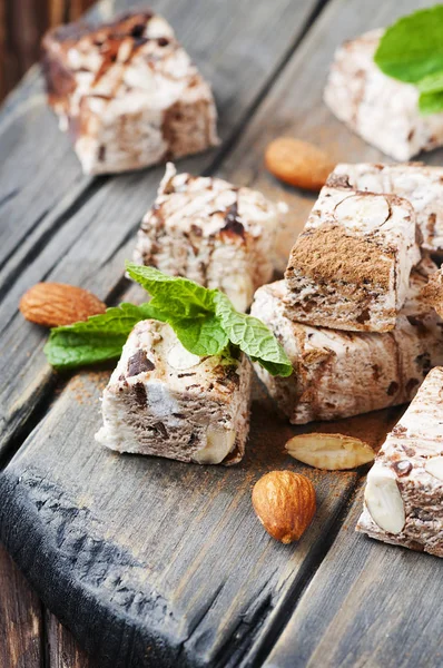 Sweet nougat with chocolate and almonds — Stock Photo, Image
