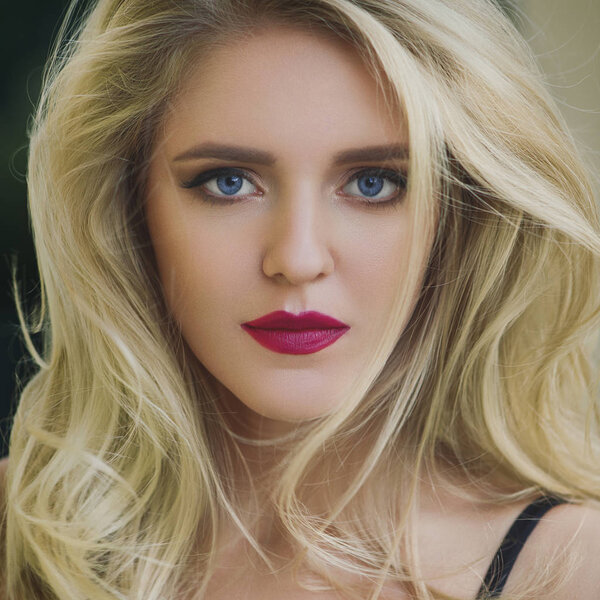 Amazing young woman with a professional make-up