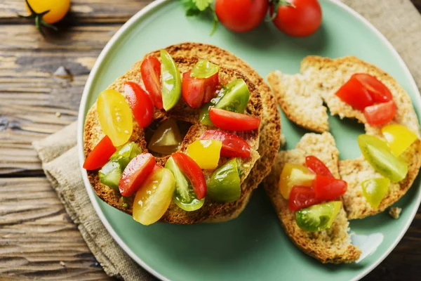 Traditional italian bread frisella with tomatoes