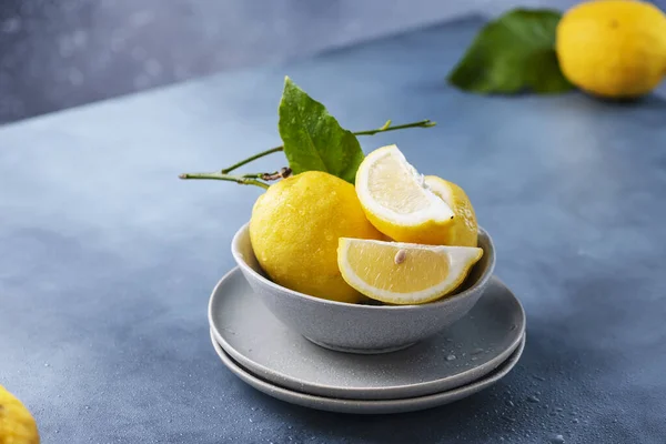 Fresh Sicilians lemons in the ceramic bowl, selective focus image