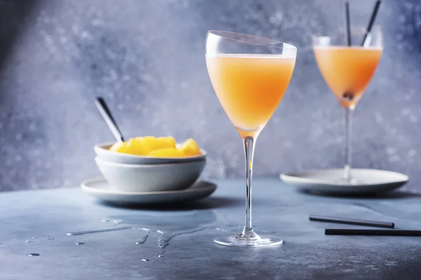 Traditional Italian cocktail bellini with prosecco and peaches, selective focus image