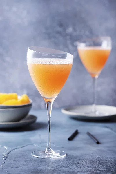Traditional Italian cocktail bellini with prosecco and peaches, selective focus image
