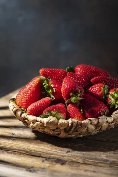 Fresh strawberry with a strong summer light, selective focus image