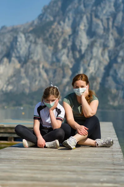 Two Frustrated Persons Medical Mask Sitting Pier Lake — Stock Photo, Image
