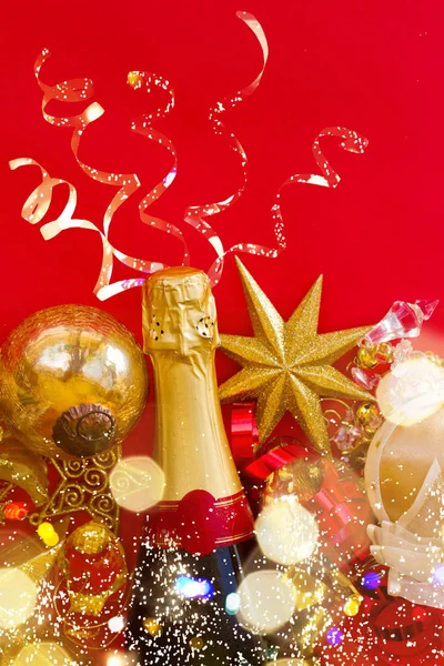 New year decorations with bottle of champagne — Stock Photo, Image