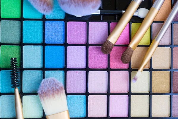 Brushes and eye-shadows palette — Stock Photo, Image