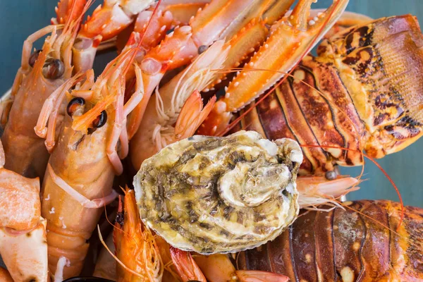 Fresh seafood on blue background — Stock Photo, Image