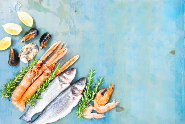 Fresh seafood on blue background — Stock Photo, Image