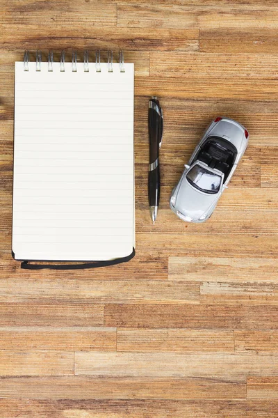 Toy car with notebook — Stock Photo, Image