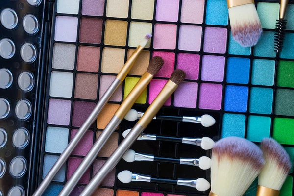 Brushes and eye-shadows palette — Stock Photo, Image