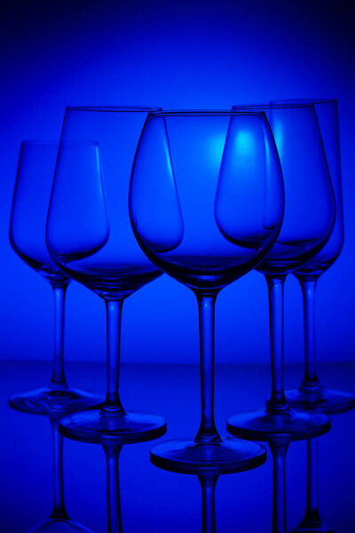 Wine glasses on blue