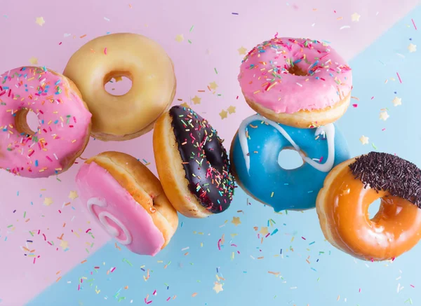 Flying doughnuts on blue — Stock Photo, Image