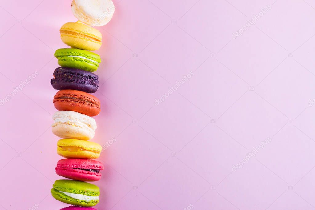 Macaroons cookies on pink