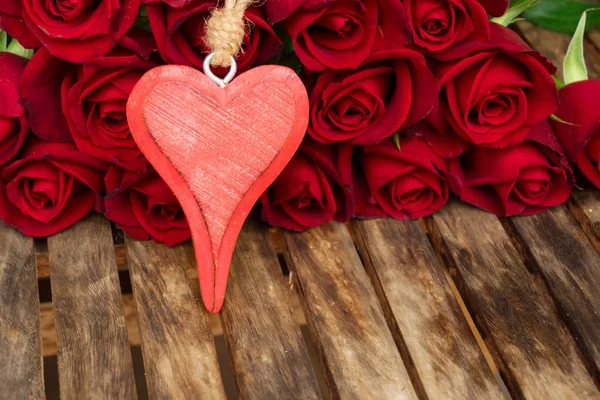 Dark red roses on table — Stock Photo, Image