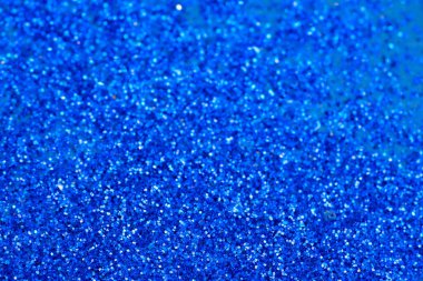 Güzel bir Noel ışığı arka planı. Soyut parıltı bokeh ve saçılmış altın parıltıları, siyah üzerine