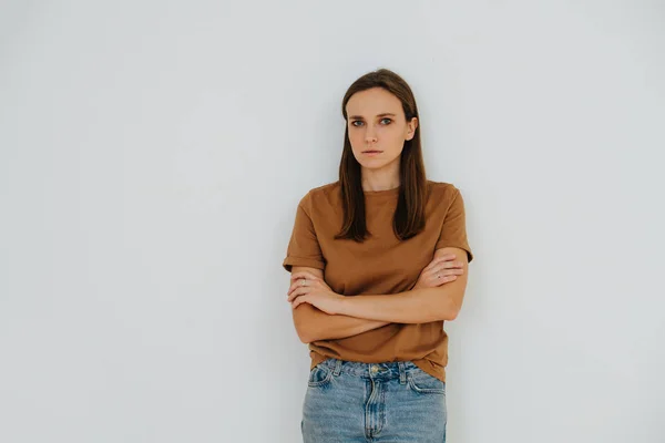 Portrait of a woman, with hands crossed and serious, stressed look. — ストック写真