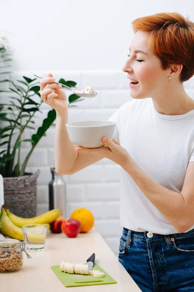 Happy Middle Aged Woman Short Ginger Hair Eating Muesli Milk — Stok fotoğraf