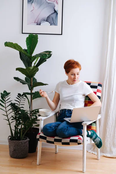 Emotionless Middle Aged Woman Short Ginger Hair Eating Muesli Chair — 图库照片