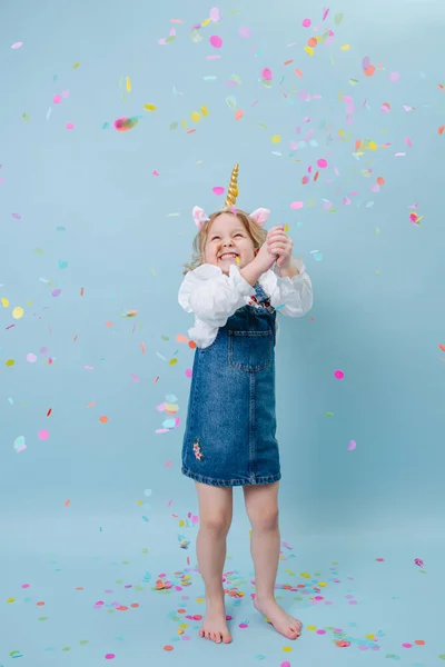 Happy Little Blonde Girl Unicorn Head Band Jeans Overalls Celebrating — Stock Photo, Image
