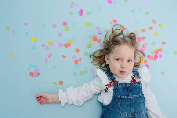 Happy Little Blonde Birthday Girl Jeans Overalls Lies Blue Surfaced — Stock Photo, Image