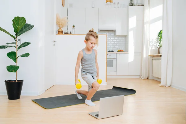 Blonde Boy Doing Online Workout Dumbbell White Kitchen — Stock Photo, Image