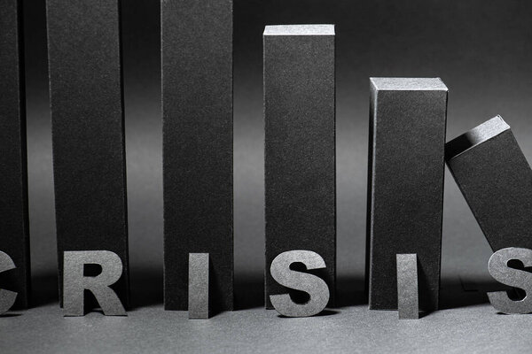Crisis word over falling 3d bar chart made in black color over shades of gray