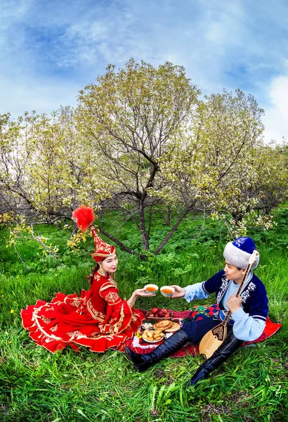 Kazakh couple in the garden — Stock Photo, Image