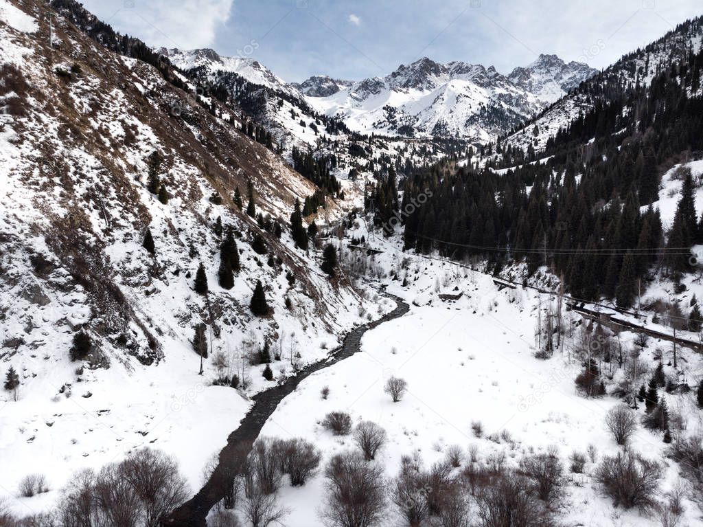 Landscape of river in the valley of Tian Shan mountains at winter time in Almaty, Kazakhstan